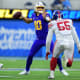Dec 12, 2021; Inglewood, California, USA; Los Angeles Chargers quarterback Justin Herbert (10) throws as New York Giants inside linebacker Reggie Ragland (55) moves in during the second half at SoFi Stadium.